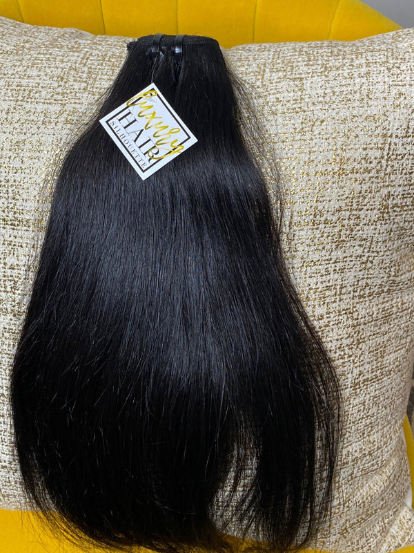 Level up with our LHS Cambodian Cashmere Natural Straight. Our Cashmere Natural Straight has a medium lustre, slightly coarse but the sleek texture will blend seamlessly with your natural hair after being straightened. Support your natural hair journey with Cashmere Natural Straight, which has been pre-wash with the finest organic products. Each bundle is expertly crafted with fullness from roots to tips to give you the thick & polished look that will leave you feeling like a queen. 