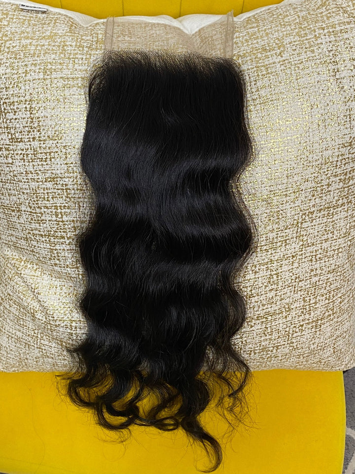 Our 100% Cambodian Luxe Natural Wave 5X5 Lace Closures are a great for clients who are looking for a seamless, undetectable, natural-looking finish. Our closures are made using a technique that makes the hairline look like it is growing naturally from your own scalp. Closures are available in l 12",14",18" or 20" with a 5 by 5 base. Note: Closure knots do not come bleached.